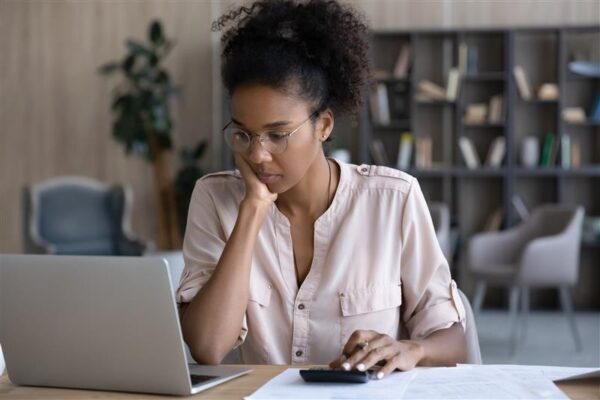 woman looking at laptop screen